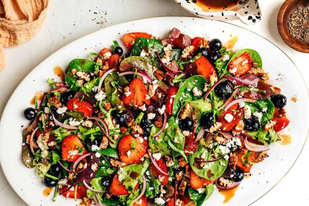 Salad with greens, tomatoes, and cucumbers