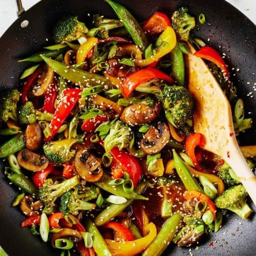 Chicken and vegetable stir-fry in skillet